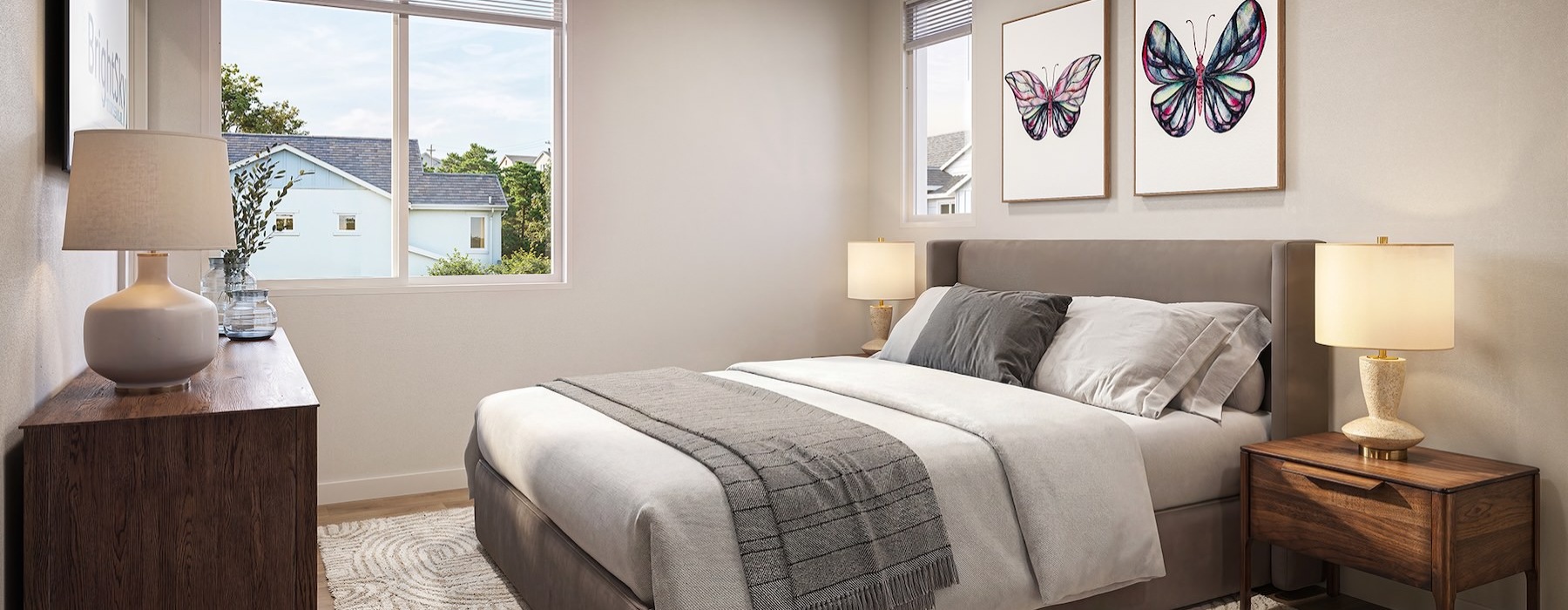 a bedroom with a bed and lamps