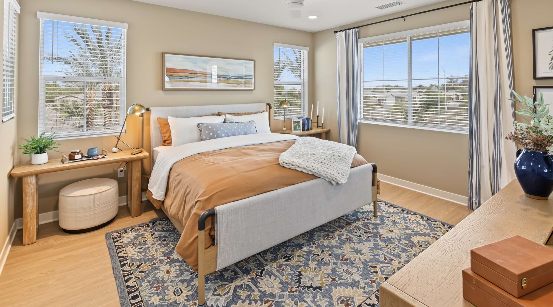 Master Bedroom at Haven with large windows, a ceiling fan, and space for a bed, nightstands, and dresser.
