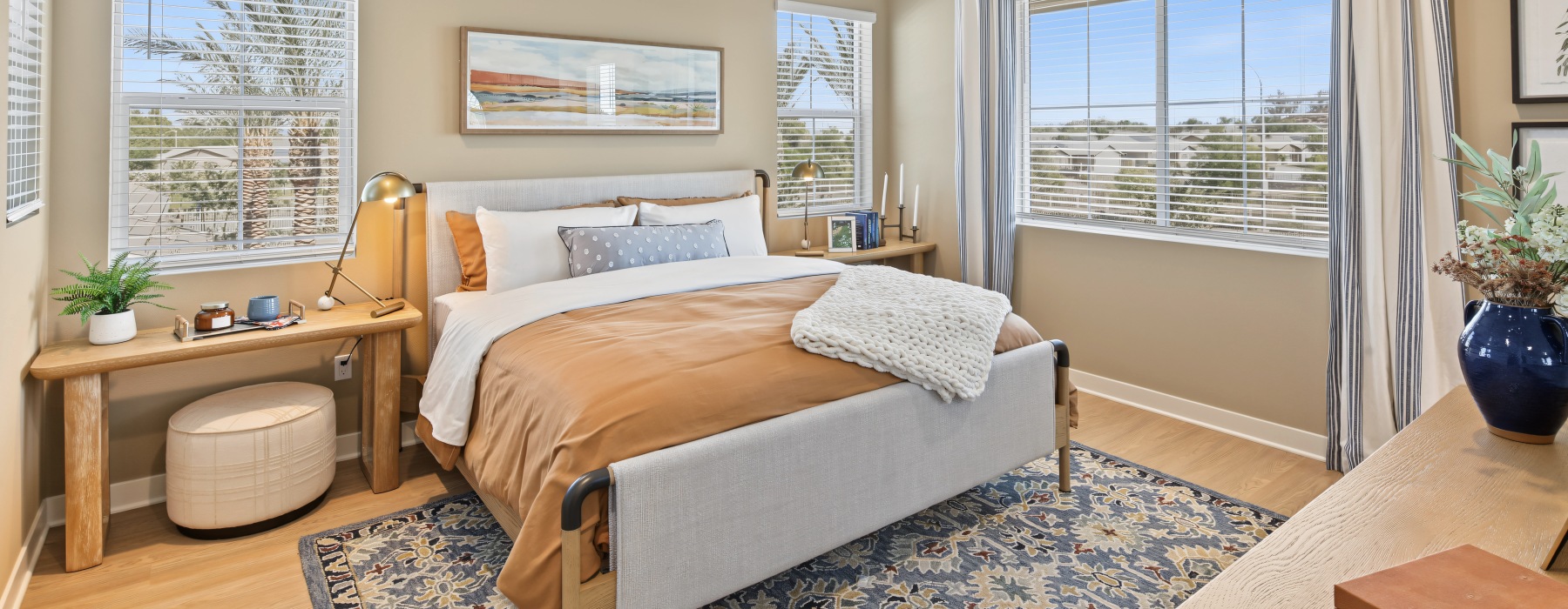 Bedroom at Haven with large windows, a ceiling fan, and space for a bed, nightstands, and dresser.