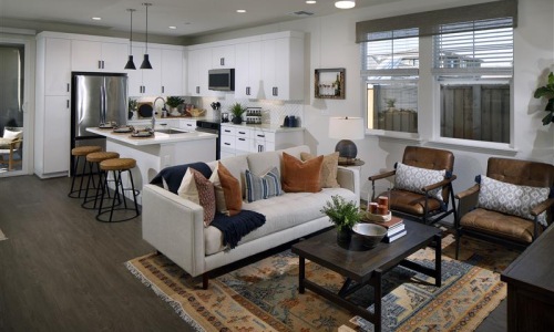 a living room with a couch and chairs