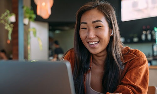 a woman looking at a computer