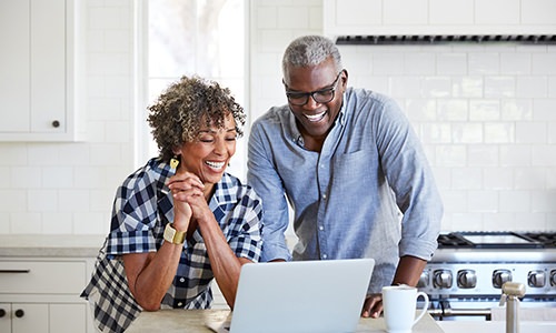 a couple looking at a computer