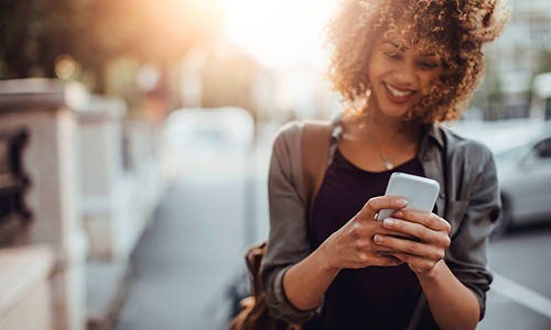 a woman holding a phone