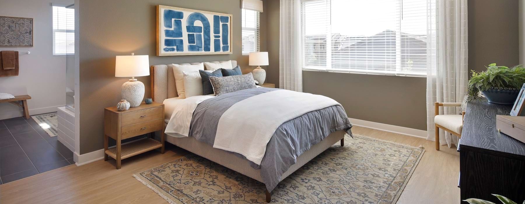 a bedroom with a bed and two nightstands