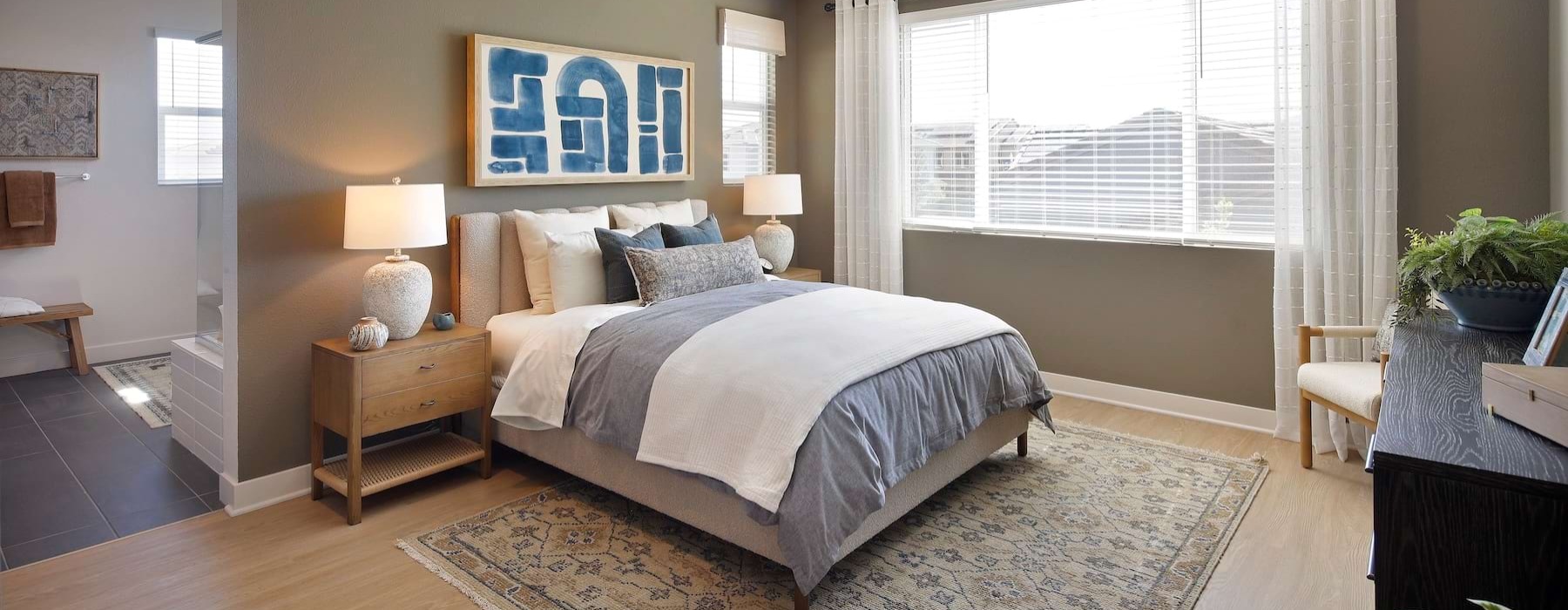 a bedroom with a bed and two nightstands