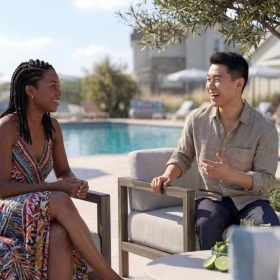 a man and woman sitting in chairs